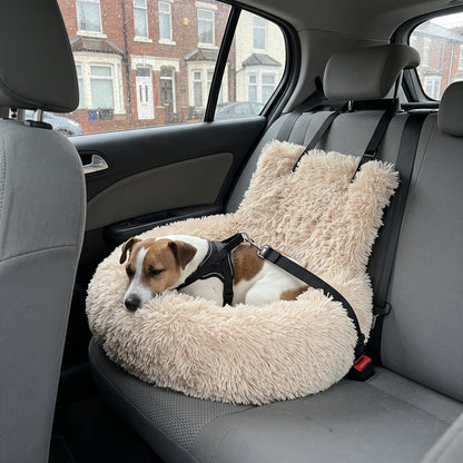 Jack Russell asleep in the SnugRide Car Bed, clipped in by his harness with the Safety Tether